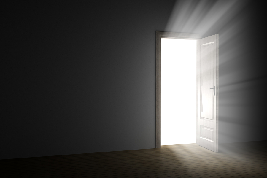 bright light through an open door in empty room - Significant Lives